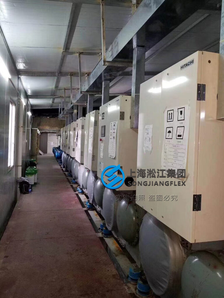 SCM spring vibration isolators installed on Hitachi screw compressor, industrial vibration and noise reduction solution